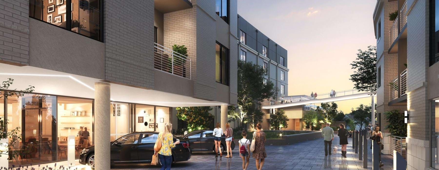 People walking on sidewalk outside at The Seventeen Hundred on East apartments in Charlotte, NC.