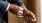 a close-up of hands getting dressed